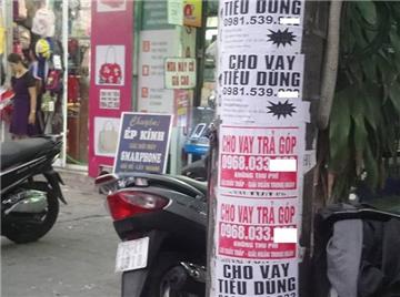 Dán quảng cáo có số điện thoại trên cột điện, phạt đến 2 triệu đồng 